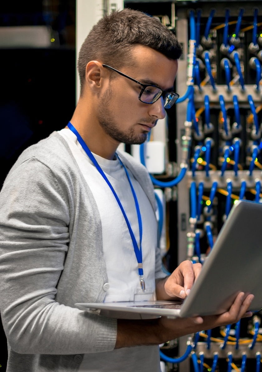 Man Managing Supercomputer Servers Man Managing Supercomputer Servers